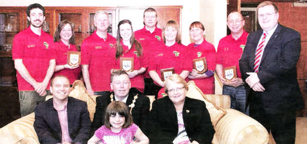 Former Mayor. Alderman Paul Porter held a reception in the Mayor's Parlour on Monday May 23. one of his last engagements as Mayor. for a team from Maze and Ballinderry Presbyterian Churches who are going on a Mission Africa trip to 0gugu in Nigeria from July 1-17- The team will be involved in outreach work including running a Bible Club for Aids orphans as well as maintenance and Aids awareness work at the Mission Africa Centre in 0gugu. The Mayor presented the team with Council Plaques to take as gifts for their hosts. 