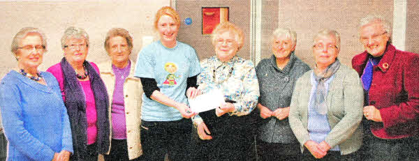 Members of the Lisburn Cathedral Mother's Union present the proceeds of their fundraising to Sarah Quinlan from the Children's MR) Scanner Appeal. L-R Adeline Toase, Betty Irwin, Mary McCormack, Sarah Quinlan, Jean Hughes, Rae Henderson, Margaret Quigley, Rosemary Kelly