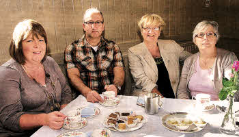 Lisa Kennedy, Garvin Jess, Marti e Kennedy and Margaret Quigley having a snack during the cake sale and coffee morning at Lisburn Cathedral. US3811507cd