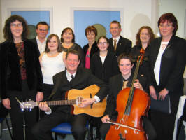 St. Patrick�s Folk Group pictured during final rehearsals before taking to the stage at the Carols in the City concert in Lagan Valley Island on Wednesday 14th December 2005. Pictured L to R : (seated) Neal Clenaghan - Guitar and Dermot Clenaghan - Cello. (back row) Geraldine Clenaghan - Leader, Andrew Magee - Keyboards and flute, Laura Waterworth, Deirdre Waterworth, Una Tracey, Dymphna Clenaghan, Patrick Hughes, Monica McCard and Marion Green.