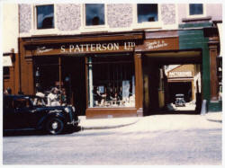 Smyth Patterson Ltd., Timber and Hardware shop in 1957.  Pictured outside is Harold�s Austin Ten car, and at the bottom of the entry is the timber yard.  The Lisburn city centre shop is now a modern ten-department store.