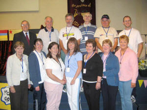 Pictured above are leaders who organised a great week of fun and excitement at the �Champions Holiday Bible Club� in Hillsborough Elim Pentecostal Church on Monday 22nd to Friday 26th August 2005. L to R: (back row) Pastor Jimmy Ritchie, Pastor Sandy Beckett, Des Cameron, Victor Bradley, Bertie Greenfield and Gareth Robinson. (front row) Louise Cameron, Debbie Leslie, Stephanie Ritson, Joanne Kenny, Olive Bradley, Pat Cardy and Odette Redmond.