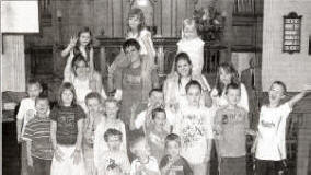 Some of the leaders and children who took part in a Service in Railway Street Presbyterian Church on Sunday 7th August 2005, recalling a fun-packed week at the 2005 Holiday Bible Club called �Heatwave�. Pictured L to R: Young leaders - Emma Cochrane, Jamie Humphries, Jordan Humphries and Lauren Mulholland. (back row - on leader�s shoulders) Anna Curragh, Sarah Jane Jamieson and Katie Jamieson. (second row) Matthew Menown, Alex Reid, Hannah Brown, Sam Brown, Sara Menown, Matthew Nelson, Ross Mulholland, Daniel Nelson and Joshua Curragh. (front row) David Wallace, Tim Curragh, Ben Nelson and Robbie Jamieson.