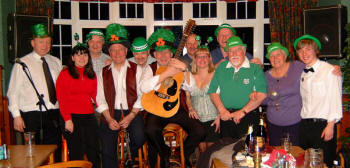 Drew Rowan (left) and Noel McMaster of Bakerloo Junction pictured with some of the many Irish music enthusiasts at a St. Patrick�s night party in the Ivanhoe Hotel, Carryduff, last weekend. Drew Rowan (left) and Noel McMaster of Bakerloo Junction pictured with some of the many Irish music enthusiasts at a St. Patrick�s night party in the Ivanhoe Hotel, Carryduff, last weekend.