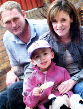 Georgia with her parents Gary and Debbie after an emotional return home after her successful bone marrow trans-