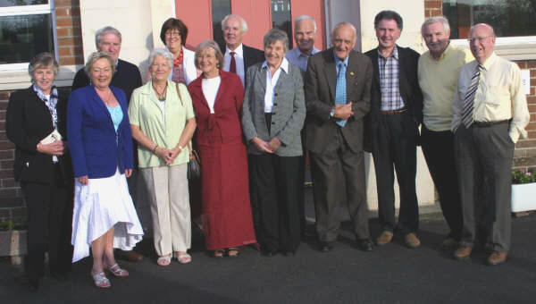 Past and present Tullymacarette teachers L to R: Mary Hughes - Vice Principal (1975 to present), Laura Cairns - Principal (1996 to present), Arthur Gibson - Former Principal (1974 - 1996), Margaret Potts - Teacher (1956 - 1991),Isabel McDowell (nee Poots) - School Secretary (1987 - present) and Joan Bloomer - Teacher (1984 - 2000) are pictured with former pupils William Lindsay, Marjorie Cushnie (nee Kelly), Clarence Morton, Stanley Stewart, Dr Harold Harvey, John Kelly and Sam Thompson at an �Open Night� at Tullymacarette Primary School on Friday 1st June marking the forthcoming closure of the school this summer. Stanley Stewart (fourth from right) attended both the old and present Tullymacarette school.