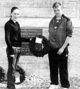 Christina Mulholland from St Patrick's and Luke Cairns from Lisnagarvey lay a wreath.