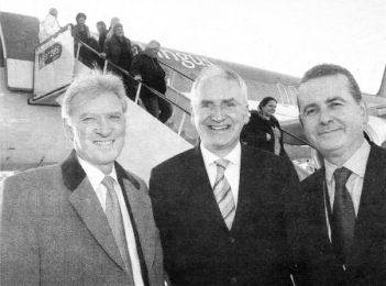 Department of Enterprise Trade and Investment Permanent Secretary Stephen Quinn greets the first passengers to arrive on the inaugural Aer Lingus flight from Amsterdam. He is pictured with Aer Lingus Chief Executive Dermot Mannion and Belfast International Managing Director John Doran