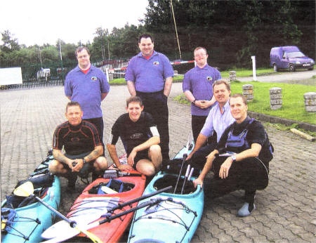 Lisburn Athletes Andrew, Simon and Jamsey wish George, Colin and Dennis good luck. Included is Moore Brand of Carrickcraft, one of the sponsors.