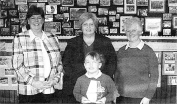 Lillie Jackson with principal Gwen Forsythe, of Charley Memorial PS, teacher assistant Marilyn Campbell with Chief Executive of the SEELB Irene Knox.