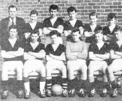 Lisnagarvey football team 1959-60. Standing (left to right): Mr. W. J. Morrison (Headmaster), K. McCabe, J. Smith, H. Birney, B. Hull, C. Campbell. Sitting: N. McConnell, K. Farr, R. Smyth, V. Grattan, G. Ward, R. Neill.