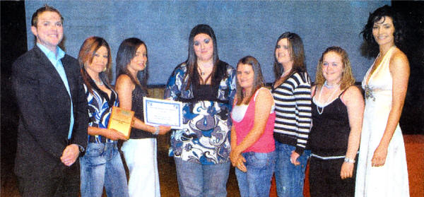 Colin Area Youth Forum from the greater Colin area scooped top prize in the Outstanding Achievement category of the Northern Ireland Youth Awards 2007. Pictured is Mary Gormley, former Miss Ireland and Thomas Kane, BBC who hosted the ceremony, presenting the award to Ciara Gallagher, Christine McKinney, Aisling Branney, Danielle Hughes, Melissa McCartan and Aiofe Digney from the Youth Group.