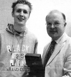 Wallace pupil Steven Adams presenting a gift from Wallace high to the Curator of the Wallace Collection Jeremy Warren.