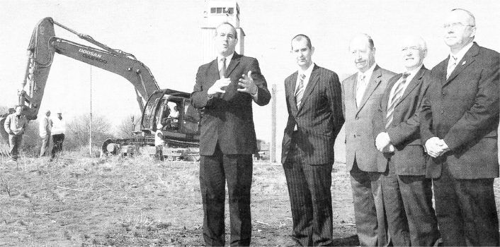 Minister David Hansen with Lisburn Councillors and Maze Panel members Edwin Poots, Peter D'Hagan, Jim Dillon and Paul Butler as the Maze wall is about to be demolished. US1407-118A0.