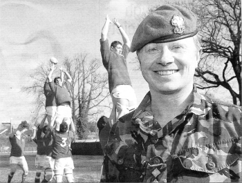 Captain James Bunyard a member of the 1st Battalion of the Royal Welsh Regiment watching the U19 Welsh rugby team