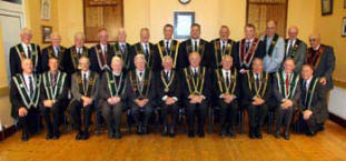 Sir Knt Raymond MacRoberts (Worshipful Master) and members of Covenant of Peace RBP 435 pictured with District and County Officers at a meeting marking the centenary of Whitehill Orange Hall.