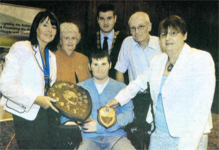 Jonathan Keery (centre) who won the Flogas Shield at The William Keown Trust Personal Achievement Awards. Included are Trust President Kate Smith, Jonathan's mother Pat, Down Council Chairman Colin McGrath, Jonathan's father Tom and Marie McStay.