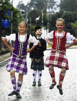 Pictured at the launch are Highland Dancers, Amy Gray (left) and Holly McMullan (right) with Drum Major and current title holder Emma Barr from Ravara Pipe 