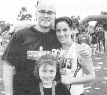 Husband Donald and daughter Zoe congratulate Melanie at the end