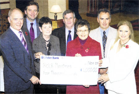 Joan Cunningham (right) from Saintfield Show Committee presents a cheque for �4,000 to Ian and Phyllis Hasson of Rock Ministries (NI) Trust to support their project for the Ugandan Orphans.