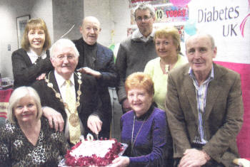 With the cake to celebrate the 10th anniversary of the Lisburn branch of Diabetes UK were Pat Crosskery, Beverley Matherson, Pat McGreeny, James Crosskery, James Napier, Maureen Johnston, Mayor Ronnie Crawford and Diabetes Nurse Hilda Francey.