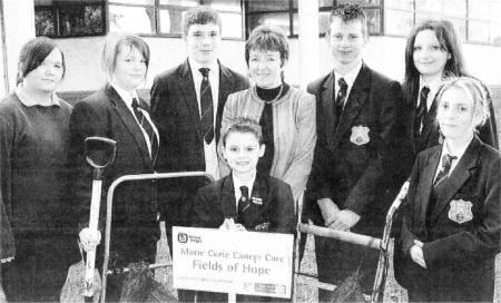 Marian Getty, principal, and Katrina Hawthorne, Amy Nixon, Nathan Stewart, Kurtis Dickson, Lloyd Gillespie, Emma Carlisle and Amy Walton, pupils at Forthill College, get ready to plans 'bulbs at the school to raise funds for Marie Curie Cancer Care as part of Forthill's 50th anniversary celebrations. US4208-531cd