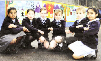 Pupils Cherin Jose, Fintin Zhang, Emma Ewing, Anna Furey, Faustas Paurys and Evalin Paulson, show off the school's new multicultural murals. US3708-551cd