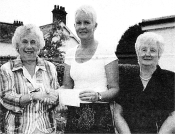 Anne Hannan from Marie Curie Cancer Care receiving a cheque for �1,000 from Inner Wheel's Vivienne McMeekin and Norma Coggins US2408-408PM