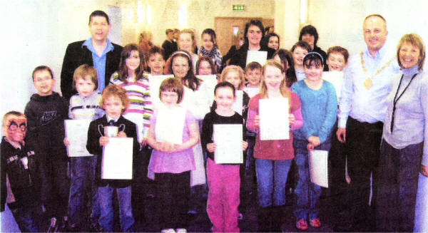 Mayor James Tinsley and Mrs Tinsley with Stephen McLoughlin (LSM Principal) and exam graduates of Lisburn School Of Music.