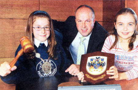 Rebekah MacAuley from Carr Primary School and Kate Gordon from Meadow Bridge Primary School accompany the Mayor of Lisburn, CIIr James Tinsley, on his official duties on Wednesday 18th June, after winning the short story competition If I was Mayor for the day'.
