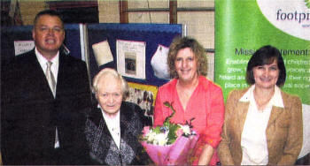 Michael Keenan (Principal of St Luke's Primary School), Frankie McNally (one of the founding members of Footprints Women's Centre), Gillian Gibson (Manager of Footprints Women's Centre), Eileen Wilson (Refresh Catering Manager)