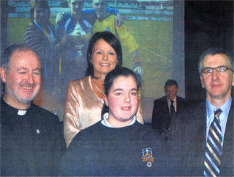 Mairtian 0 Muilleoir, guest speaker, with Imelda Jordan, Principal, Father Murray, Chair St Colms High School with winner of Monsignor Bartley Award Patricia Neilson, who attained top marks in 6 GCSEs.