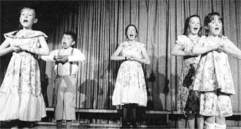 Sarah Watters, Caiomhe Glover, Callum Brannan, Aideen Drayne and Laura Buchanan sing songs from the Sound of Music as the Von Trapp children.