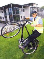 Wheels in motion: Christopher Carvill Managing Director of the Caryl!! Group gets on his bike to launch Woodbrook in Lisburn. This latest �160m concept for the pioneering developers is the province's first eco-village and all of the energy efficient homes, which start from �99,950 come complete with a free bicycle and bus pass