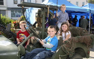 Dylan Smyth pictured behind the wheel of war vehicle with passengers Andrew Shaw, Nicola Shaw and rear gunner Peter Clarke.