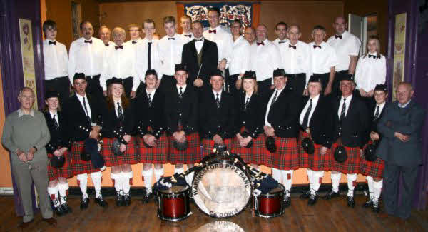 Aughnaskeagh Silver Band and Waringsford Pipe Band pictured at the Variety Concert in Maghaberry Orange Hall last Friday evening (September 25) hosted by Roses Lane buds Flute !Banf. Included are Roy Wilson Secretary and Sandy Wilson, Chairman (right).