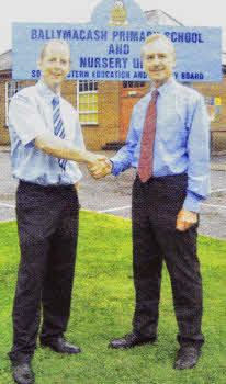 The retiring Principal of Ballymacash Primary Wes Gilmore wishes his successor Stephen Gray good luck.