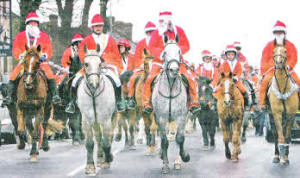 Joan Cunningham leads the Saintfield Christmas Charity Ride which included upwards of 180 riders along the town's Main Street. 