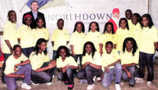 The Mwamba Choir members with Alastair Mcllveen of North Down Marquees and Joan Cunningham who organised the Saintfield Christmas Charity Ride.