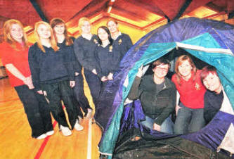 Tents and other equipment donated by Downshire Camping to Elmwood Girls' Brigade. Pictured in tent: (I-r) Louise Preston from Downshire Camping, Laura Wilson - Officer and Karen Williamson - GB Captain, with some of the girls from the GB. US4709- 359DW