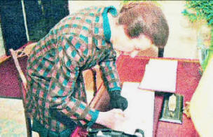 The Princess Royal signing the visitors book