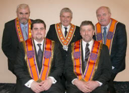 L to R: (seated) Bro Dr Jonathan Mattison (Worshipful District Master) and Bro Maurice Coburn (Deputy District Master).  (back row) Bro Victor Harrison (County Grand Master), the Most Worshipful Robert Saulters (Grand Master) and Bro Samuel Walker (Deputy County Grand Master).