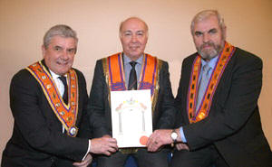 Outgoing Worshipful District Master Bro Eric Jess receives his Past District Master’s certificate and collarette from The Most Worshipful Robert Saulters (Grand Master) and Bro Victor Harrison (County Grand Master)