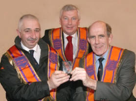 Newly installed First District Lecturer Bro Alan Jess (left) presents a gift to Bro Harold Graham in recognition of over 23 years exemplary service as First District Lecturer.  Looking on is Bro Mervyn Kernaghan (Second District Lecturer).