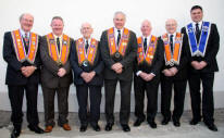 L to R: Brothers - Jim Martin (District Tyler), Francis Beckett (District Marshal), Fred Scandrett (Deputy District Master), Norman Bell (Worshipful District Master), Edward Carson (District Chaplain), William Gilmore (District Foreman of Committee) and Graham McDonald (Committee).