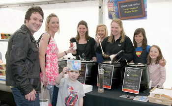 Jonny McCutcheon and his son Joshua and Jenny Thomson pictured at the Farmer’s Market in Castle Gardens as Lisburn girls Sharon and Kathy McMaster of Soupernatural, serve up their range of local seasonal original soups.  L to R: Sharon McMaster (Soupernatural), Sarah McCallan (Summer Delights), Kathy McMaster (Soupernatural), Olivia Novaes and Keela Suckling.