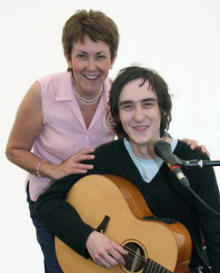 Ruth Mormecha is pictured with her son Michael who entertained shoppers at the Farmer’s Market in Castle Gardens.