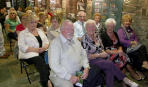 Nelson and Pat Williams and some of the audience enjoying the fun at the Lock Keeper’s Cottage.