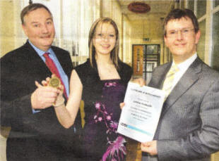 Jeffrey Donaldson, MP MLA, and Ken Webb, Director, South Eastern Regional College, congratulate Janice Galbraith.