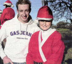 Joan Cunningham with the celebrity guest "Farmer Andy" from Cool FM who judged the best turned out Santas at the Christmas Charity Pleasure Ride in Saintfield in aid of under-privileged children in Uganda and Rwanda. 